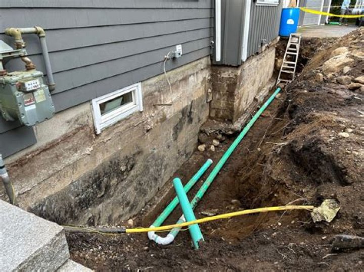 Can sewer pipe go through footing