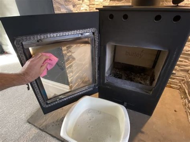 How do you clean the glass on a wood stove