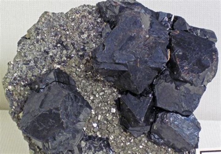 What rocks is sphalerite found in