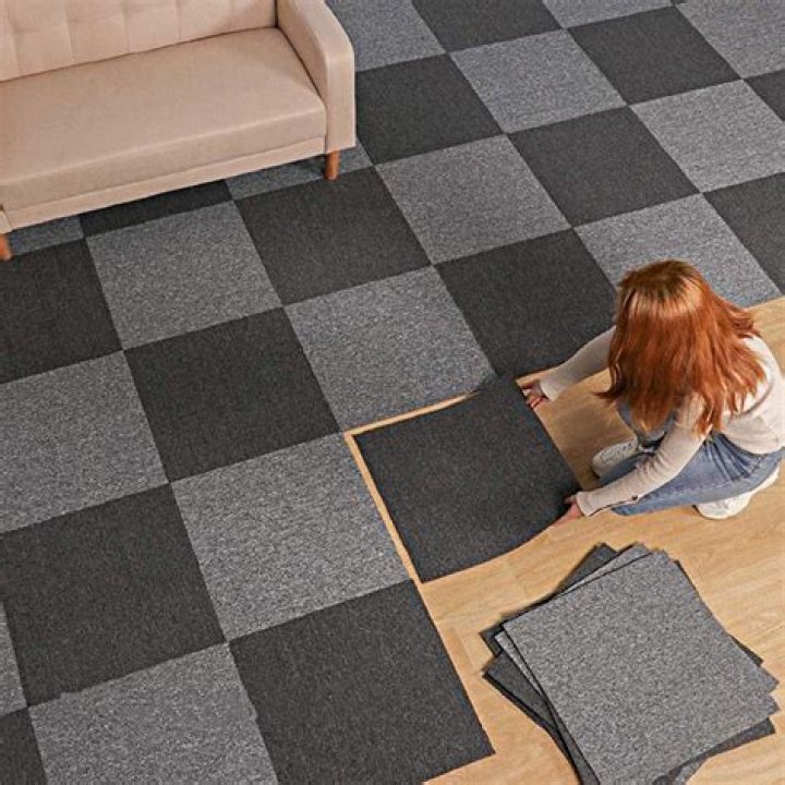 Will carpet tiles stick to carpet